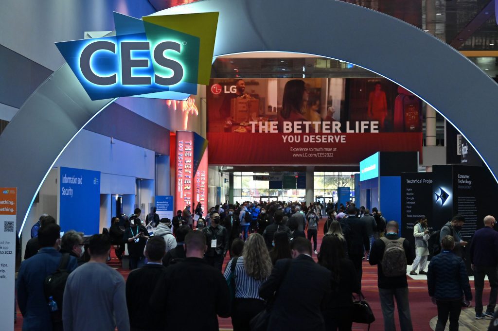 CES 2023 conference hall with logo and people entering show.